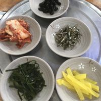 Banchan- Sides. kimchi, soy braised soy beans, kelp, yellow radish (be careful as kimchi might contain fish sauce)  at Korean Soy Silken Tofu 우리콩순두부 in Busan