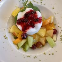 Half board desert: lemon sorbet with fruit salad  at Hotel Klausen Pass in Unterschaechen