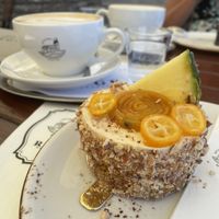 Carrot cake with exotic fruits and lavender cappuccino   at Apátsági Rege Cukrászda in Tihany
