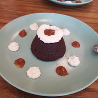 Chocolate souffle. Perfectly executed.  Salted caramel blobs oit of this world.   at Le Jardin in Biarritz