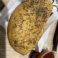 vegan cheese pie (sauce does not come with it, we ordered extra ketchup)  at ATH - Gregory's - Departures in Athens