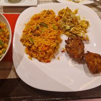 Biriyani, onion bhaji and samosa chat at Kis Bangla in Budapest