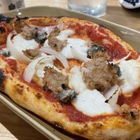 Vegan tuna, onion and capers pizza slice, 160 baht (plus 7% tax)  at Vegano in Bangkok