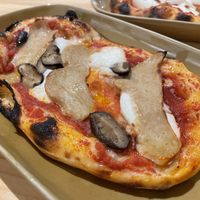 Vegan chicken and mushroom pizza slice, 160 baht (plus 7% tax)  at Vegano in Bangkok