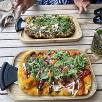 Truffle pizza and black olive pizza  at Bresca - San Antonio in Ibiza