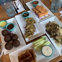 Veggie burger, spinach gyoza, polenta sticks, Brussels spout coleslaw, and teriyaki tofu wings   at The Cafe in Key West