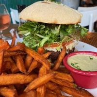 Cafe Veggie Burger (bun not gluten-free) with gluten-free sweet potatoes fries. at The Cafe in Key West