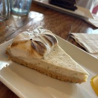 Key lime cheesecake and chocolate cake in background   at The Cafe in Key West
