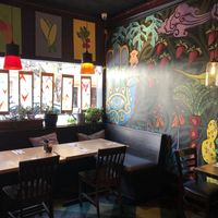 Large comfy window couches with overstuffed pillow for a relaxing time with friends at The Cafe in Key West