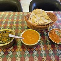 Aloo palak, chana masala and baignan bhatha with roti.  at Little India - Indian and Nepalese Cuisine  in Sanya