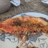 Half eaten ripieno ripieno pizza at Uga - Uga in Fuerteventura