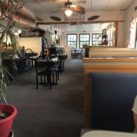 Inside dining area.  Lots of surf boards and pelicans. at Bella Vida Cafe in West Cape May