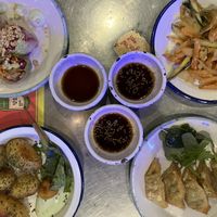 Four tapas items with soy sauces  at Kkokki Vegan House in Hamburg