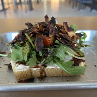The Wellsbuilt Toast- Coconut bac'n, tomato, arugula, balsamic glaze, vegan mayonnaise, coarse salt & fresh-cracked pepper  at Easy Luck in Orlando