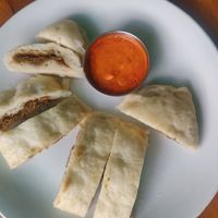Siddu - a local steamed bread stuffed with a paste of walnut and poppy seeds. Spicy and flavourful at The Healthy Kitchen in Manali