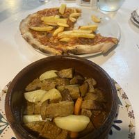 Seitan stew and kebab pizza  at Humus Vegan Tenerife in Tenerife