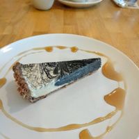 The delicious brown rice coffee and activated charcoal vegan cheesecake. Unique and delcious at Raw8 Cafe in Osaka
