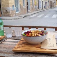 Outdoor seating next to a street at Street Food Two in Pula