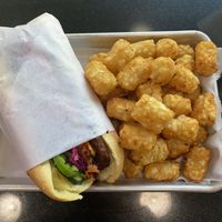 Bang mi burger with tater tots  at Plantiful Superfoods in Seattle