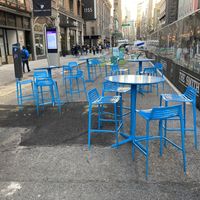 Outdoor seating in mall I front of venue at PLNT Burger - NoMad in New York City