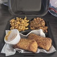 Fully vegan black eyed peas, Philly egg rolls and mac and cheese!!   at The Herbal Farmercy in Greenville