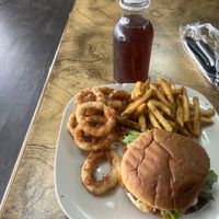 Johns burger meal with fries and onions rings  at The Herbal Farmercy in Greenville