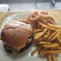 John's burger meal 2 sides and drink pictured with fries and onion rings at The Herbal Farmercy in Greenville