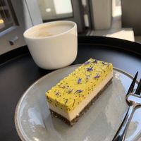 Raw cheese cake and coffee with oatmilk   at Loui in Munich