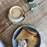 Oat latte. Cheddar, smoke tofu and kimchi toastie with slaw    at Heaphys in Glastonbury