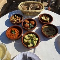 Olives, falafel, zaalouk (with lemon), hummus, avocado, and muhammara   at World Storytelling Cafe in Marrakech