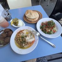 Falafel, humus, salad, pita and pickles   at Abu Dhabi Hummus in Tel Aviv