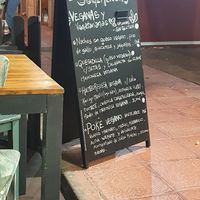 Clear sign listing all the vegan options at Carallo in San Jose