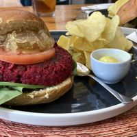 Vegan beetroot burger with caramelised onions and chips  at Carallo in San Jose