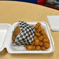 Green burger with vegan cheese and tater tots   at Twisted Burger Diner in Flint