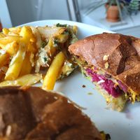 Onion bhaji and cauliflower burger with delicious red cabbage inside. We split the burgers in half so we could each try more! at Vegalution in Colchester