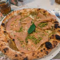 Pizza with pistachio and mortadella at Pizzeria Assaje in Milan