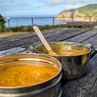 Chickpea curry and Dahl in the Spicy Mare reusable tiffin, sat in the church garden just up road at The Spicy Mare in Lynton