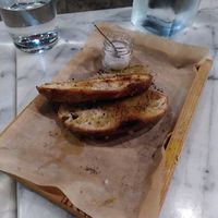 Typical Greek side dish: bread with olive oil. In this restaurant with extra salt. at Afrálato in Kalamata
