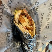 Build your own taco: flour shell with vegan chorizo, smashed tater tots, corn salsa, pickled red onions, lettuce, and a spicy sauce    at Condado Tacos in Ann Arbor