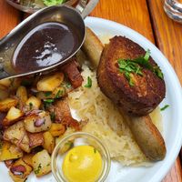 Pfälzer Saumagen mit Rotweinsauce, Bratwurst und Sauerkraut at Weinstube Eulenspiegel in Speyer