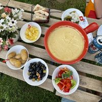 Vegan fondue with bread, potatoes, peppers, pineapple, pickles and olives oil  at Fondue Villa & Garden in Unterseen