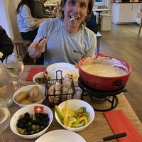 Spicy garlic bottomless vegan fondue  at Fondue Villa & Garden in Unterseen