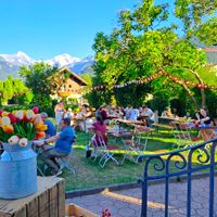 Fondue with a view of the Eiger, Mönch & Jungfrau mountains at Fondue Villa & Garden in Unterseen