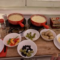 Vegan almond fondue on the left, traditional fondue on the right 🫕  at Fondue Villa & Garden in Unterseen