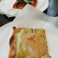 Zucchini pizza and spinach pizza at Aqui na Mata - Padaria Artesanal Vegana in Curitiba