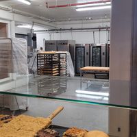 Glass bakery behin the front desk at Brauðgerðarhús Akureyrar in Akureyri