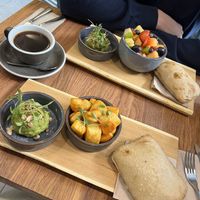 Bread, Avocado Creme, Baked potatos, seasonal fruits  at Pantry Brunch & Coffee in Budapest