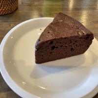 vegan chocolate cake (gateau chocolat). my daughter didn't like it that i took it away from her to take a pic..  at Pennennolde ぺんねんのるで in Chitose