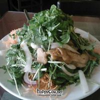 Seitan Cress vegan salad. A mound of delicious watercress with crispy seitan, raw carrots and onions with a sweet dressing. at Miss Saigon Bistro in Coral Gables