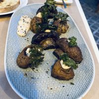 Grilled mushrooms with miso cream, fried kale leaves & parmesan cheese (vegan). It was tasty, but too much for one person    at Kalderimi in Crete